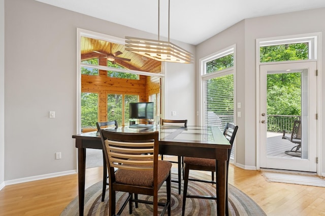 6654 Orchid Ln N, Maple Grove, MN 55311 - dining space with light wood-type flooring, baseboards, vaulted ceiling, and a ceiling fan