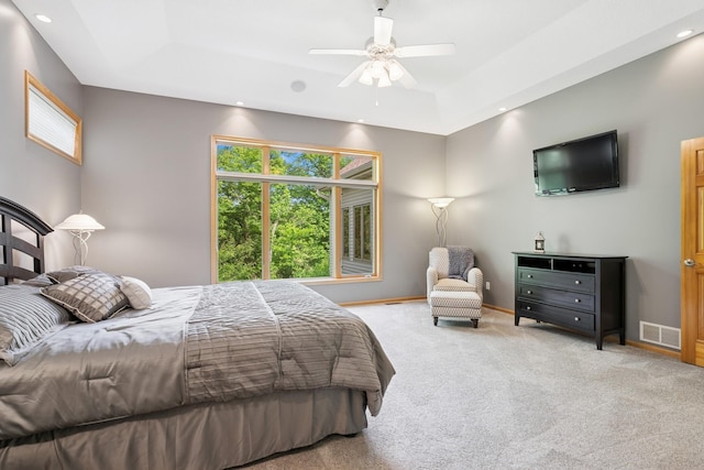 6654 Orchid Ln N, Maple Grove, MN 55311 - carpeted bedroom with multiple windows, a tray ceiling, baseboards, recessed lighting, and a ceiling fan