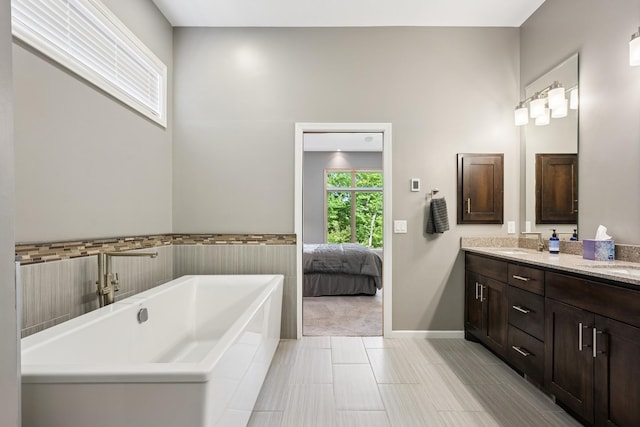 6654 Orchid Ln N, Maple Grove, MN 55311 - bathroom with a freestanding bath, double vanity, ensuite bathroom, and a high ceiling