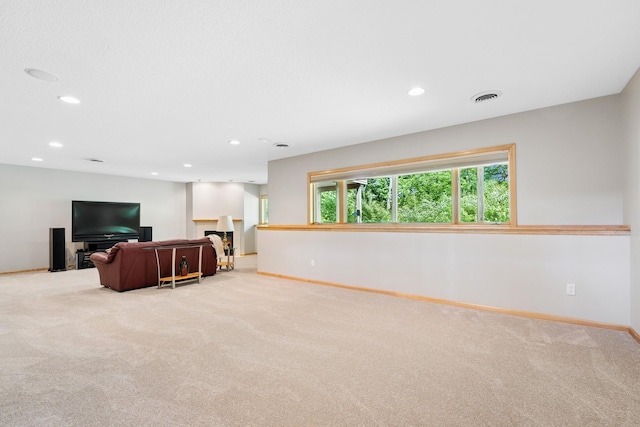 6654 Orchid Ln N, Maple Grove, MN 55311 - living area with carpet flooring, baseboards, recessed lighting, plenty of natural light, and a fireplace