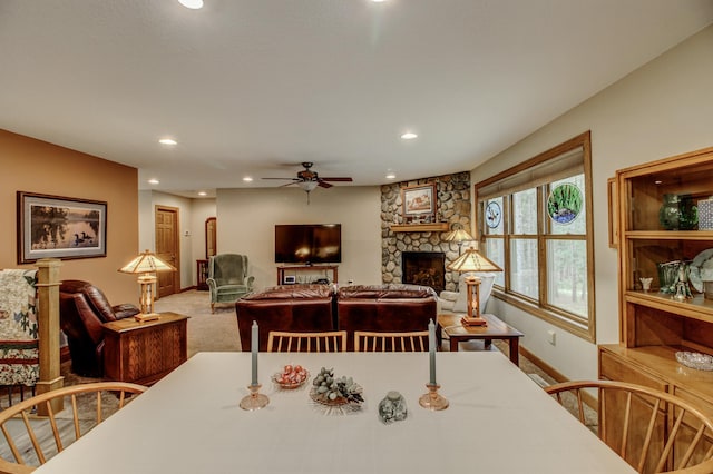 20929 Faron Dr, Nevis, MN 56467 - carpeted dining area featuring baseboards, a stone fireplace, recessed lighting, and ceiling fan