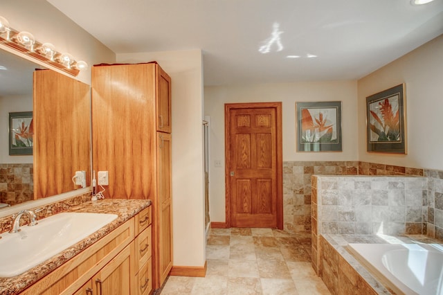 20929 Faron Dr, Nevis, MN 56467 - full bath with a bath, vanity, a stall shower, and baseboards