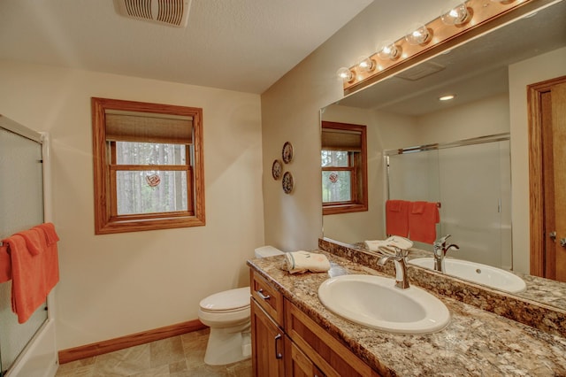 20929 Faron Dr, Nevis, MN 56467 - full bath featuring an enclosed shower, vanity, baseboards, and toilet