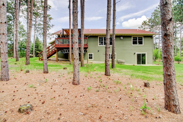 20929 Faron Dr, Nevis, MN 56467 - rear view of property featuring a deck, stairs, and a lawn