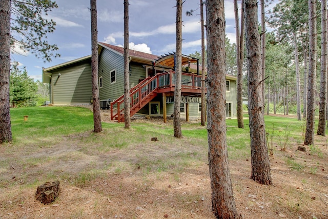 20929 Faron Dr, Nevis, MN 56467 - rear view of property with stairway, a wooden deck, and a lawn