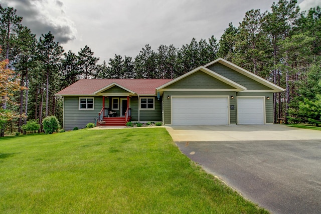 20929 Faron Dr, Nevis, MN 56467 - ranch-style home with driveway, an attached garage, a front yard, and covered porch