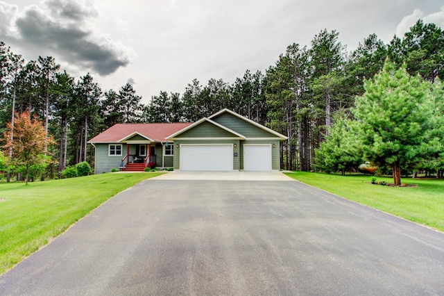 20929 Faron Dr, Nevis, MN 56467 - ranch-style house featuring a garage, asphalt driveway, and a front yard