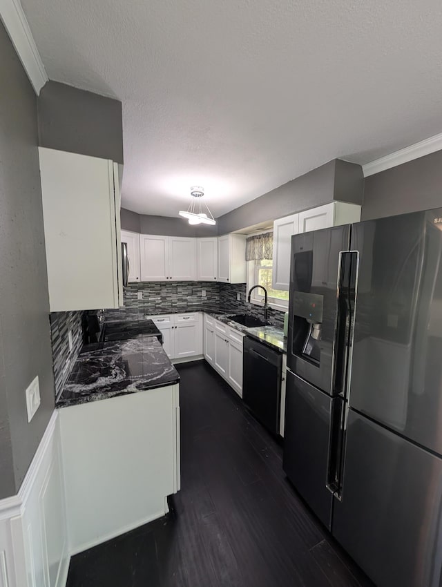 530 Cardinal St, Fairmont, MN 56031 - kitchen featuring fridge with ice dispenser, black dishwasher, a sink, white cabinets, and decorative backsplash
