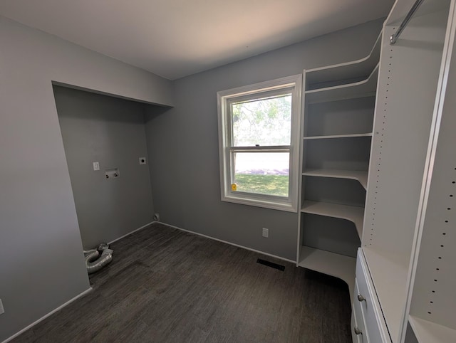 530 Cardinal St, Fairmont, MN 56031 - laundry area with dark wood finished floors, electric dryer hookup, and baseboards
