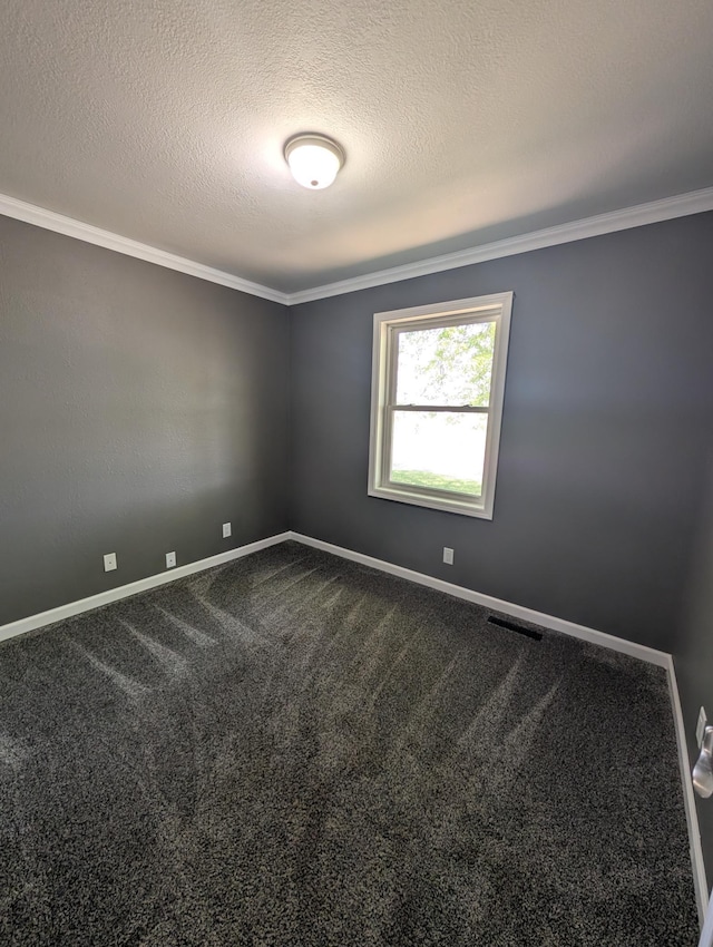 530 Cardinal St, Fairmont, MN 56031 - empty room with crown molding, baseboards, a textured ceiling, and dark carpet