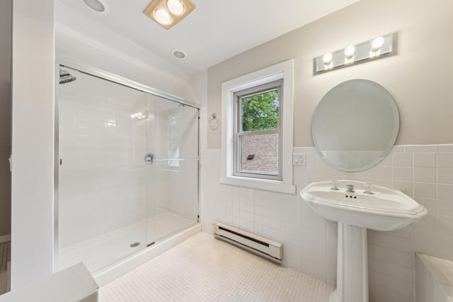 4826 33rd Ave S, Minneapolis, MN 55417 - full bathroom with a baseboard radiator, tile walls, a wainscoted wall, a stall shower, and tile patterned floors