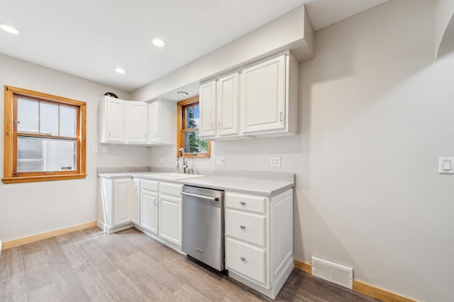 4826 33rd Ave S, Minneapolis, MN 55417 - kitchen featuring stainless steel dishwasher, a sink, light wood-style floors, baseboards, and recessed lighting