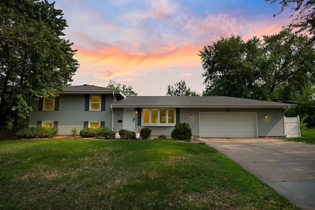 11411 Johnson Cir, Bloomington, MN 55437 - tri-level home with an attached garage, concrete driveway, and a front yard
