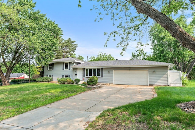 11411 Johnson Cir, Bloomington, MN 55437 - split level home featuring driveway, a garage, and a front lawn
