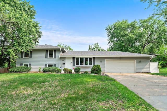 11411 Johnson Cir, Bloomington, MN 55437 - tri-level home featuring a garage and driveway