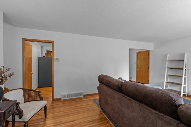 11411 Johnson Cir, Bloomington, MN 55437 - living room featuring light wood-type flooring and baseboards