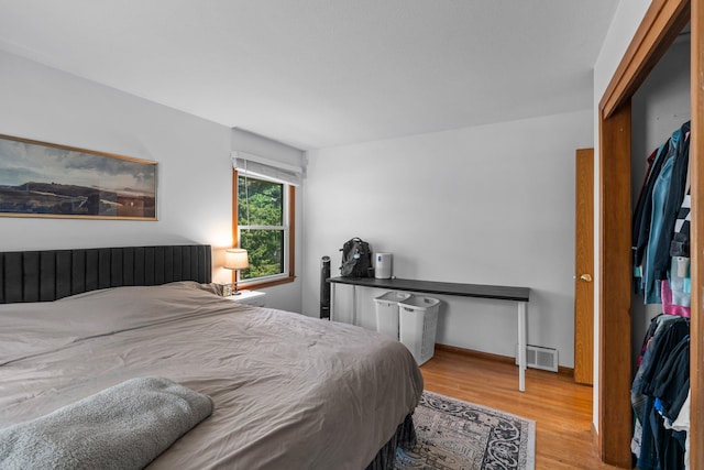 11411 Johnson Cir, Bloomington, MN 55437 - bedroom with wood finished floors and baseboards