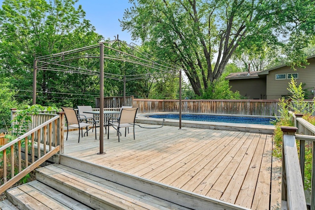 11411 Johnson Cir, Bloomington, MN 55437 - wooden deck with outdoor dining space and a fenced backyard