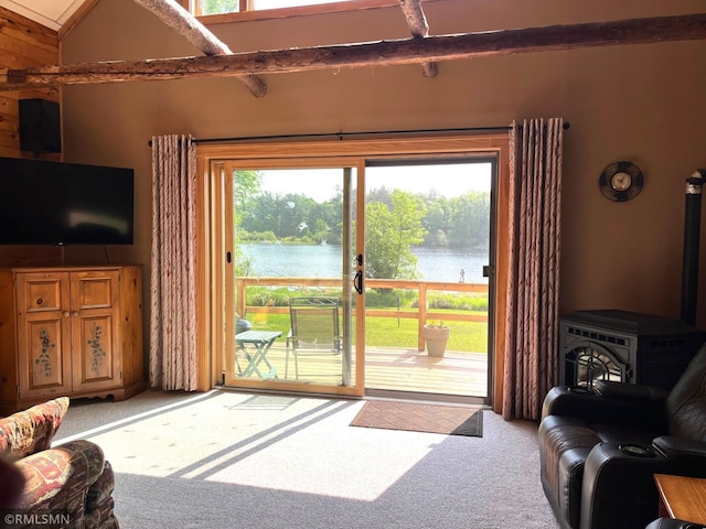 43639 351st Ln, Aitkin Twp, MN 56431 - living area with carpet, a water view, and a wood stove
