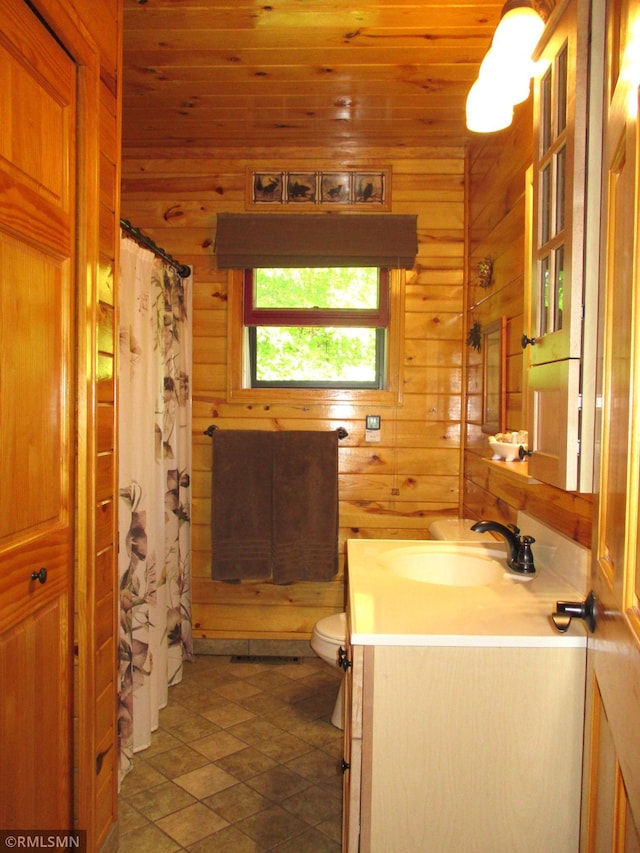 43639 351st Ln, Aitkin Twp, MN 56431 - full bath with wood walls, vanity, toilet, a shower with curtain, and wood ceiling