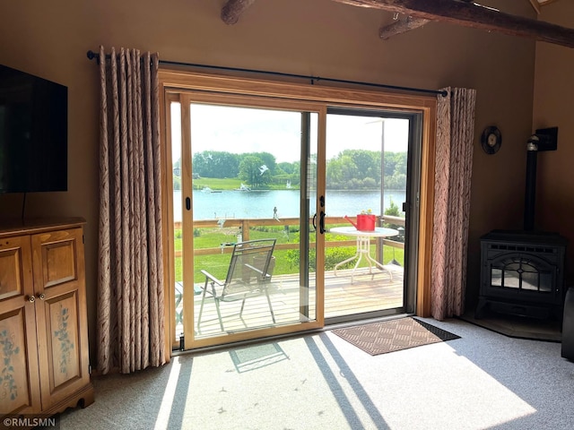 43639 351st Ln, Aitkin Twp, MN 56431 - doorway to outside featuring a water view, a wood stove, and light carpet