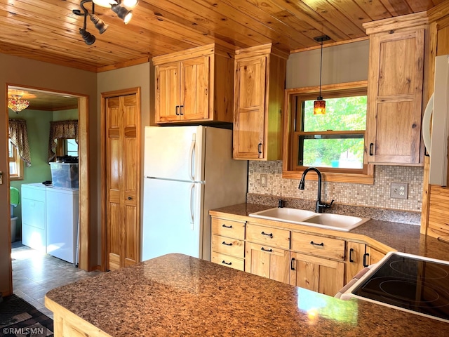43639 351st Ln, Aitkin Twp, MN 56431 - kitchen featuring washing machine and dryer, a sink, white appliances, wood ceiling, and dark countertops