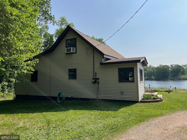 43639 351st Ln, Aitkin Twp, MN 56431 - view of home's exterior with a yard, a water view, and cooling unit