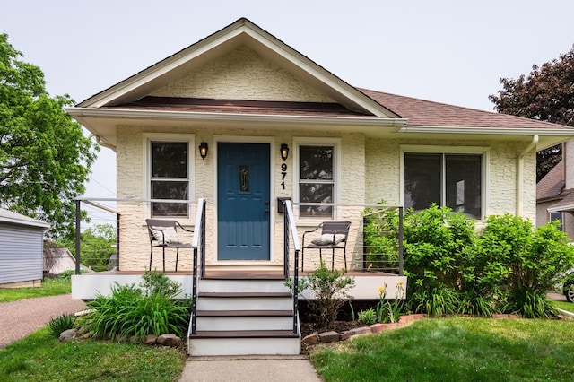 971 Mclean Ave, Saint Paul, MN 55106 - view of front of home featuring a porch and roof with shingles