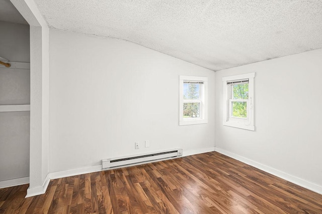 627 Skyline Pkwy, Duluth, MN 55805 - unfurnished bedroom featuring a baseboard radiator, a textured ceiling, vaulted ceiling, wood finished floors, and baseboards