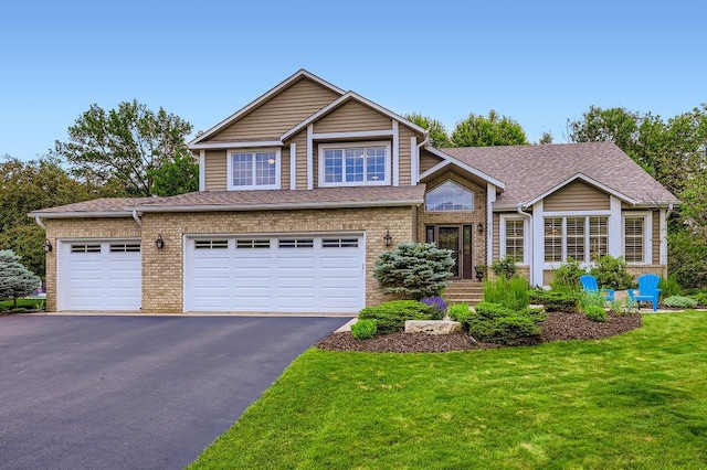 9025 Mcguffey Rd, Eden Prairie, MN 55347 - view of front of house featuring driveway, a front lawn, brick siding, and roof with shingles