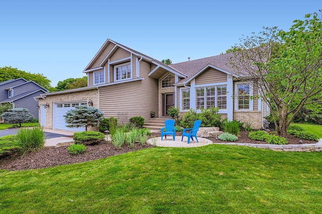 9025 Mcguffey Rd, Eden Prairie, MN 55347 - view of front facade with driveway, brick siding, a front lawn, and a garage