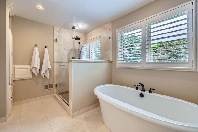 9025 Mcguffey Rd, Eden Prairie, MN 55347 - full bathroom featuring a soaking tub, a stall shower, tile patterned flooring, and recessed lighting
