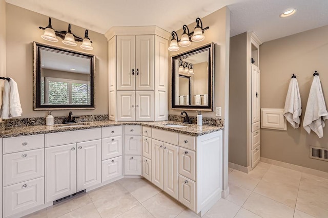 9025 Mcguffey Rd, Eden Prairie, MN 55347 - full bathroom with double vanity, tile patterned floors, and recessed lighting