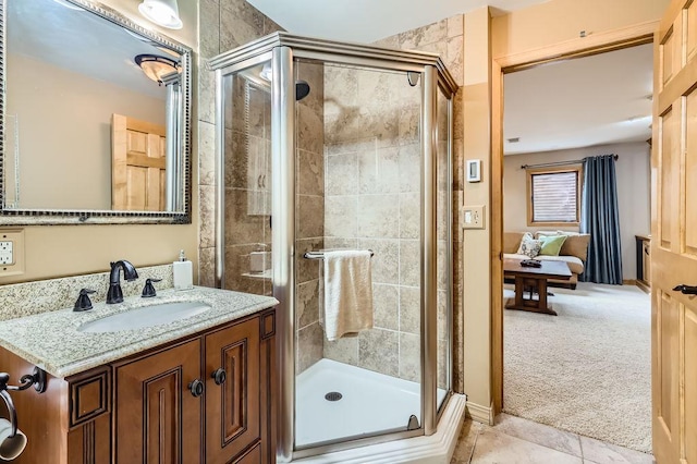 9025 Mcguffey Rd, Eden Prairie, MN 55347 - ensuite bathroom featuring vanity, a stall shower, and tile patterned floors
