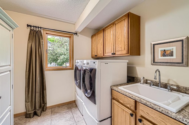 9025 Mcguffey Rd, Eden Prairie, MN 55347 - laundry room with cabinet space, washer and clothes dryer, and a textured ceiling