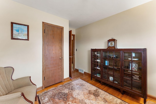2142 Cottage Ave E, Saint Paul, MN 55119 - sitting room featuring wood finished floors and baseboards