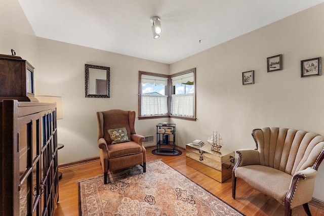 2142 Cottage Ave E, Saint Paul, MN 55119 - living area featuring light wood-type flooring and baseboards