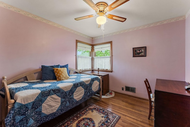 2142 Cottage Ave E, Saint Paul, MN 55119 - bedroom with baseboards, wood finished floors, and a ceiling fan
