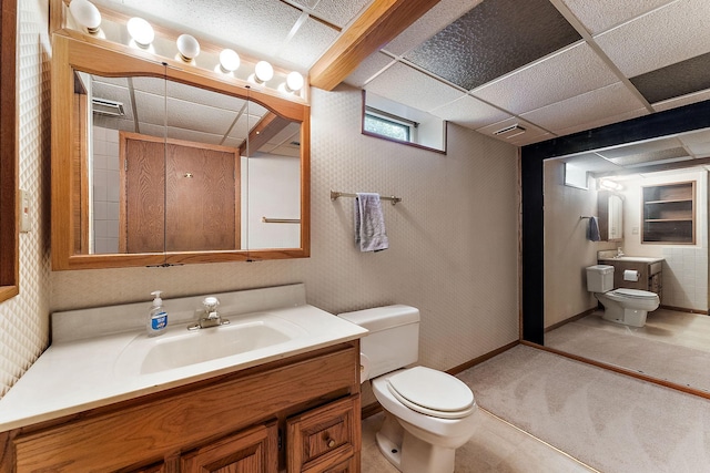 2142 Cottage Ave E, Saint Paul, MN 55119 - bathroom featuring toilet, vanity, and baseboards