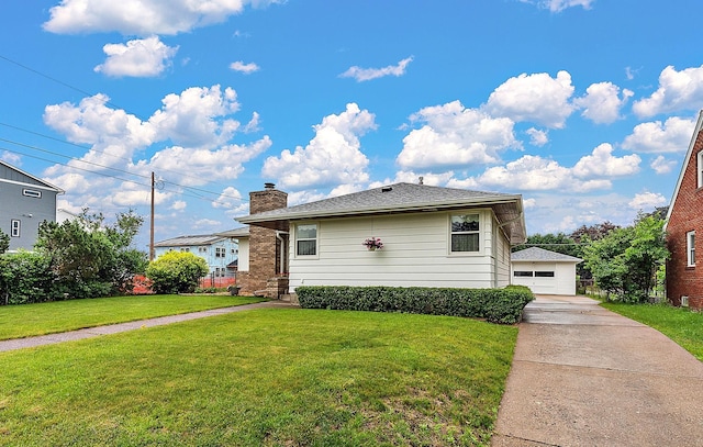 2142 Cottage Ave E, Saint Paul, MN 55119 - view of front of home featuring a front yard, a chimney, and a detached garage
