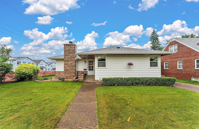 2142 Cottage Ave E, Saint Paul, MN 55119 - view of front facade with a front lawn and a chimney