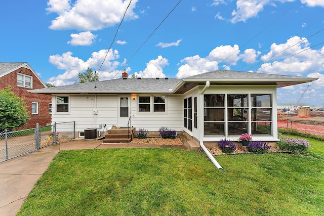 2142 Cottage Ave E, Saint Paul, MN 55119 - rear view of house featuring central AC, a sunroom, a gate, and a shingled roof
