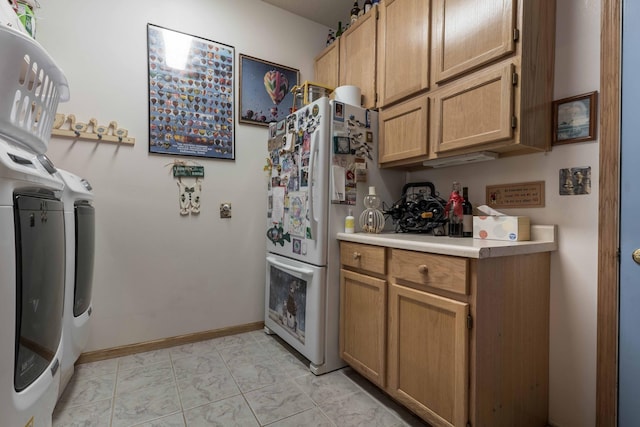 17159 Stalker Lake Rd, Battle Lake, MN 56515 - washroom featuring washer and clothes dryer, cabinet space, and baseboards