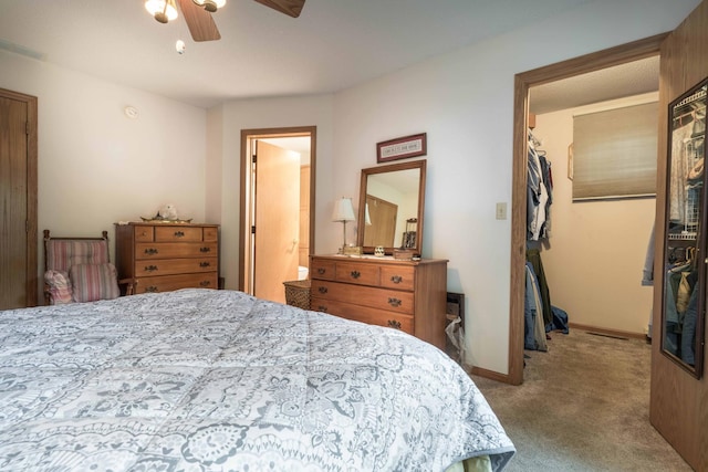17159 Stalker Lake Rd, Battle Lake, MN 56515 - bedroom featuring carpet, a walk in closet, a closet, a ceiling fan, and baseboards