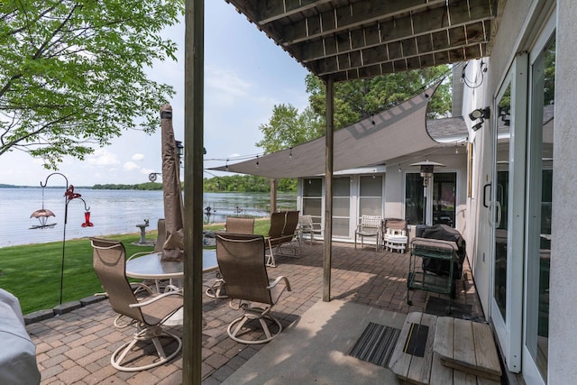 17159 Stalker Lake Rd, Battle Lake, MN 56515 - view of patio with a water view