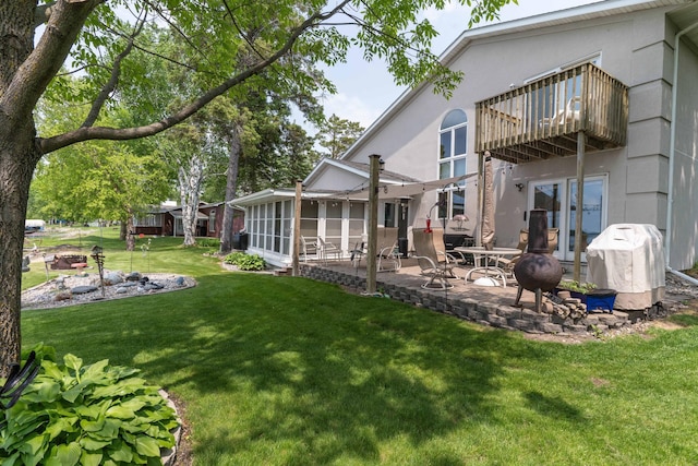 17159 Stalker Lake Rd, Battle Lake, MN 56515 - view of grassy yard featuring a patio area and a balcony