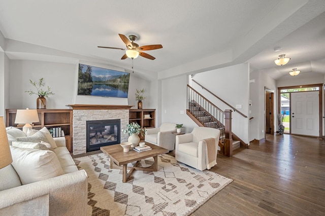 1840 Old Mill Ct, Centerville, MN 55038 - living room with wood finished floors, stairs, ceiling fan, a stone fireplace, and baseboards