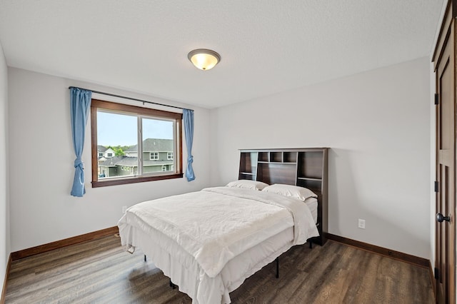 1840 Old Mill Ct, Centerville, MN 55038 - bedroom featuring dark wood-type flooring and baseboards