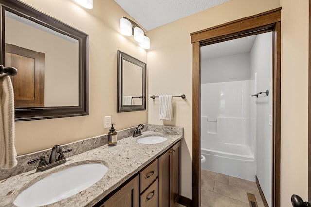 1840 Old Mill Ct, Centerville, MN 55038 - bathroom with double vanity, toilet, tile patterned flooring, and washtub / shower combination