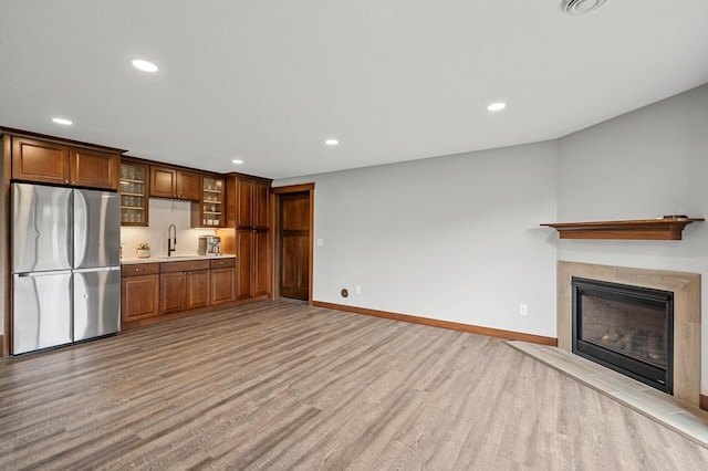 1840 Old Mill Ct, Centerville, MN 55038 - kitchen featuring freestanding refrigerator, a sink, light wood-style flooring, recessed lighting, and light countertops